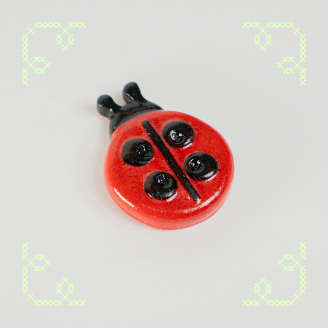 ladybug button worry stone - oopsie