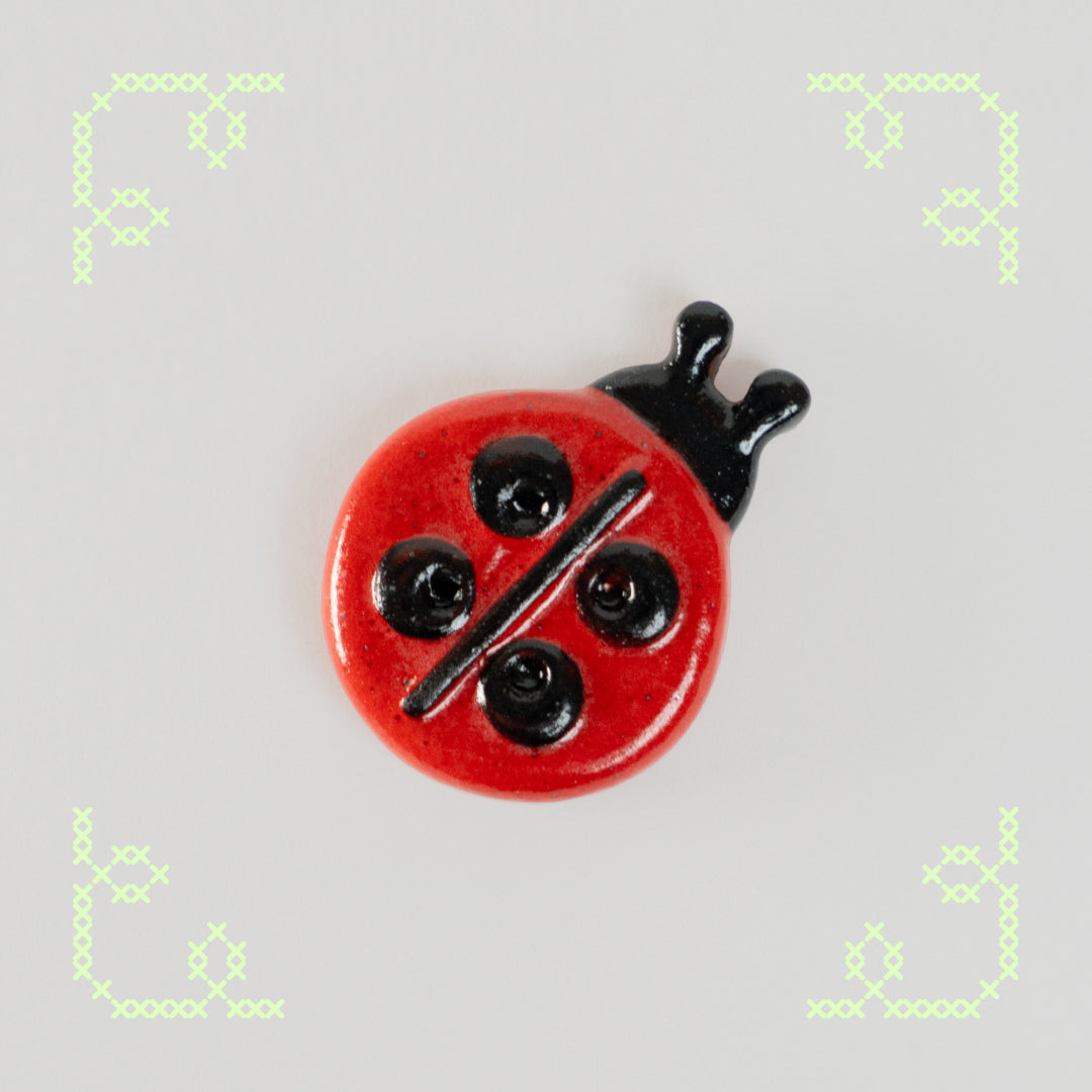 ladybug button worry stone - oopsie